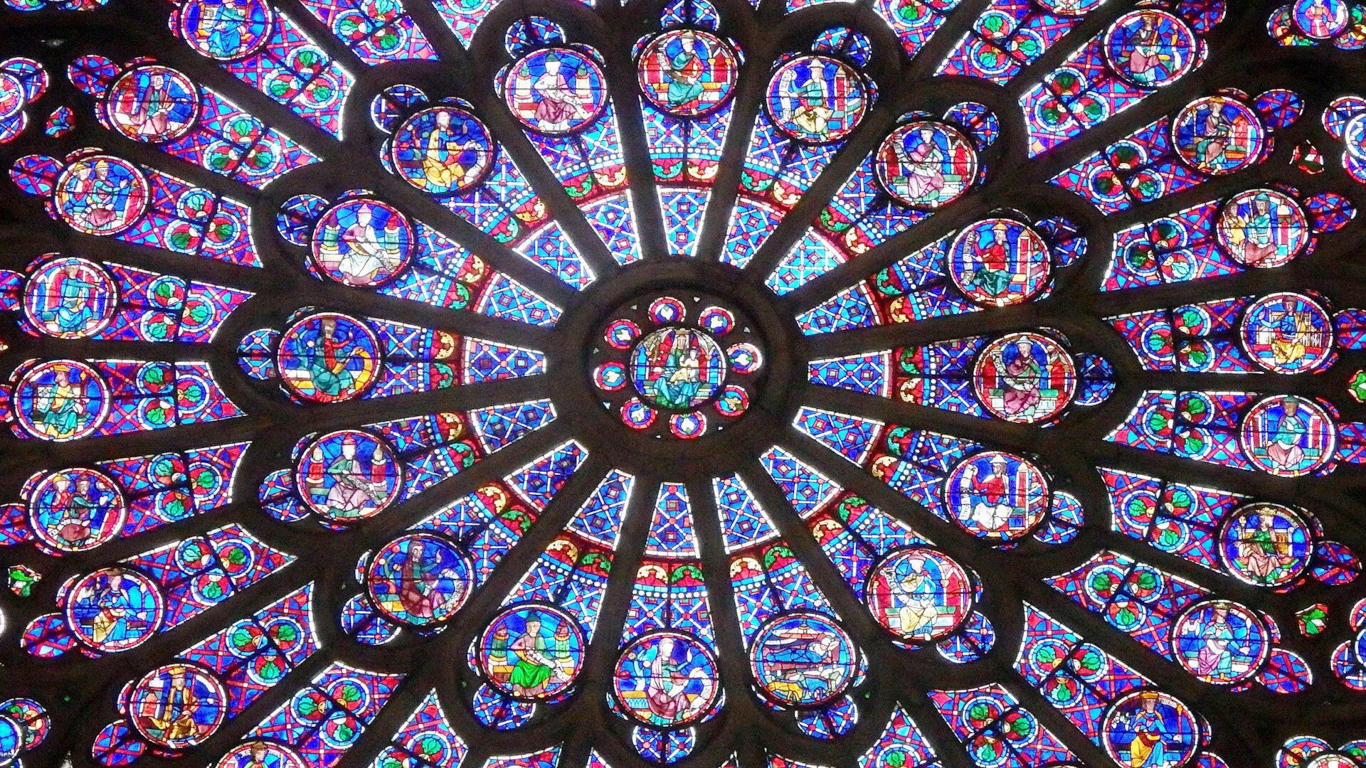 Close up of a stained glass window inside Notre-Dame cathedral