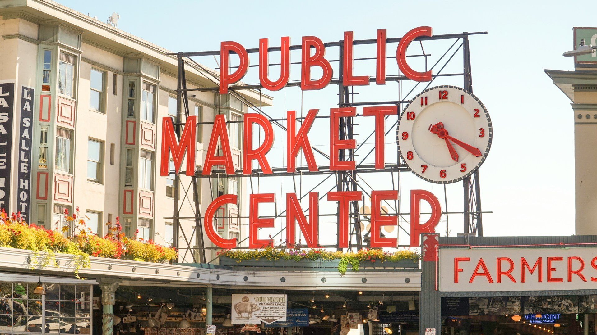 Neon sign outside the entrance to Pike Place Market, Seattle – reads: 'Public Market Center'
