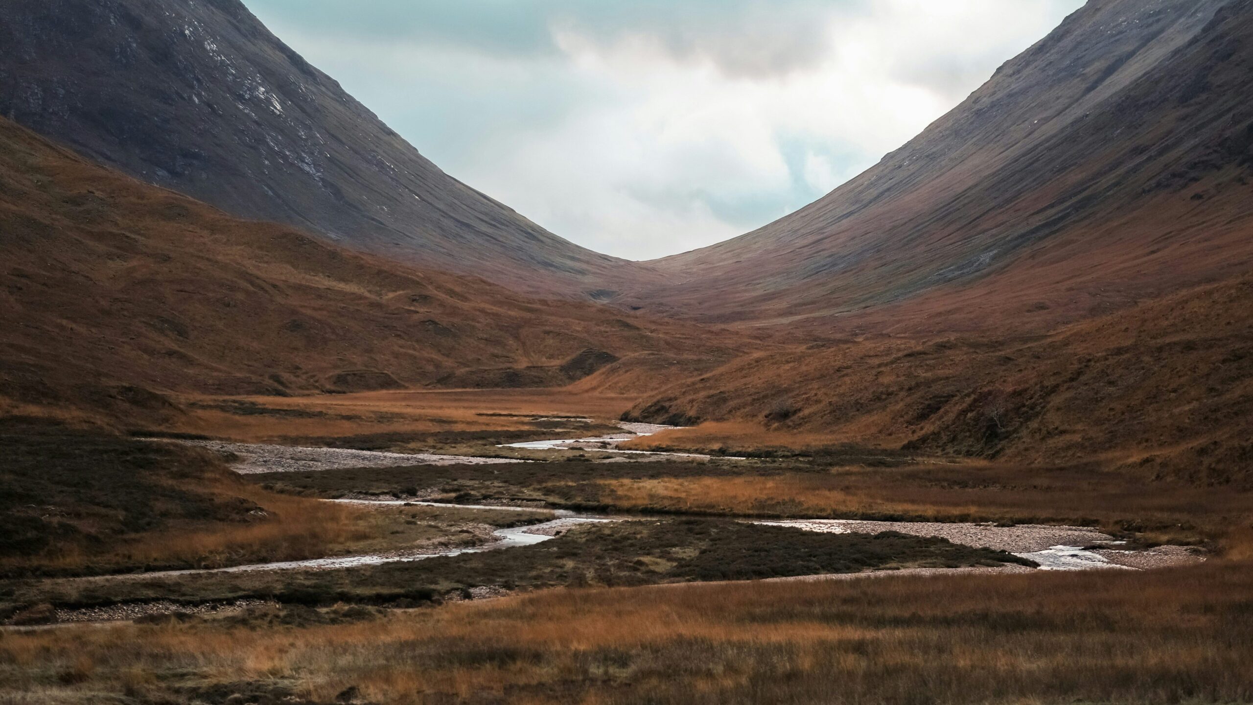 River meandering through a brownish valley